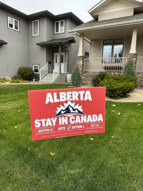 Stay in Canada lawn sign outside a home