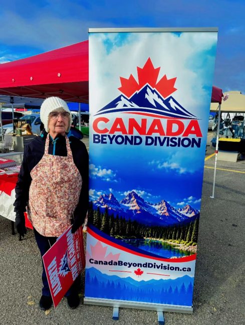 Community supporter beside the campaign banner