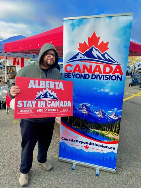 Supporter holding a Stay in Canada sign