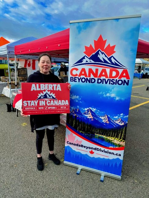 Supporter at the outdoor campaign booth