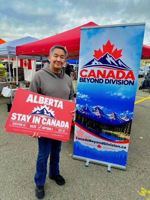 Community member holding a campaign sign