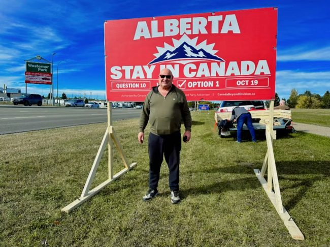 Volunteer at a roadside billboard