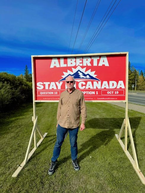 Volunteer with an installed billboard