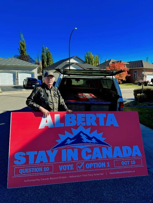 Volunteer transporting a campaign billboard