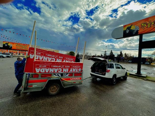 Campaign billboard being transported on a trailer