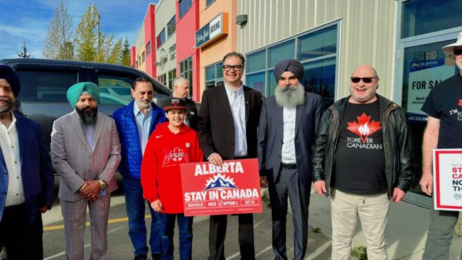 Community group with the Canada Beyond Division sign