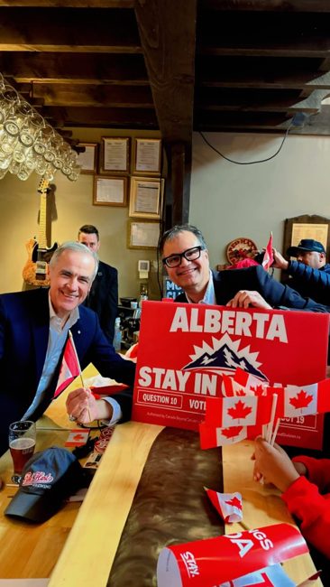 Community gathering with a Stay in Canada sign